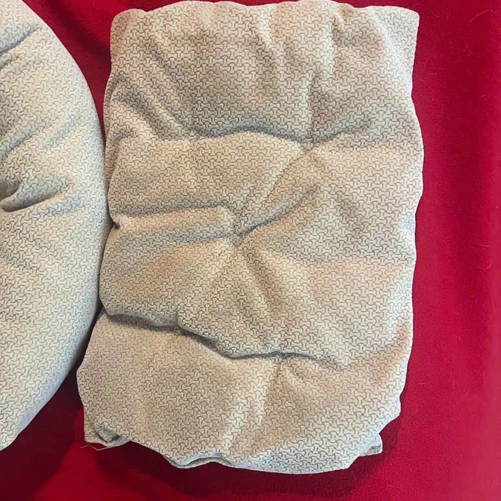 Gently used small dog or cat bed. Small round dog bed in a light color.